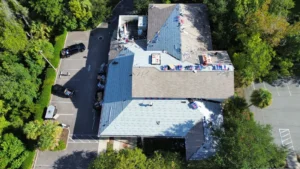 Commercial building roof replacement in progress by LePierre Roofing