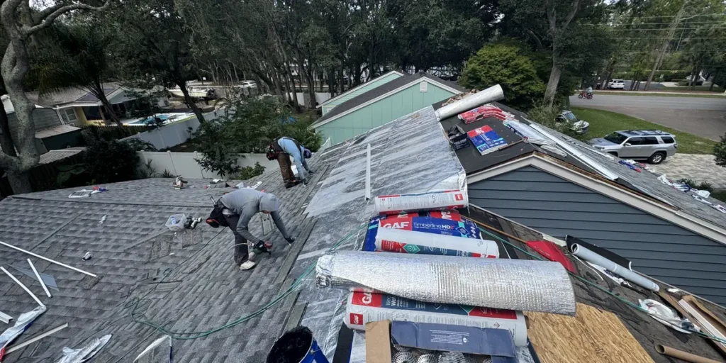 LePierre Roofing crew repairing a shingle roof